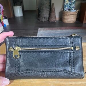 The Sak Black Leather Zip Wallet with Gold Hardware Accents
